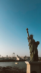 Odaiba, Tokyo. March 13, 2024: Statue of Liberty in Tokyo with beautiful sunset. 