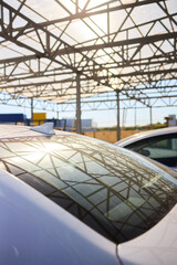 Car Sales and Loan Industry Concept. Row of Brand New Vehicles in Stock.