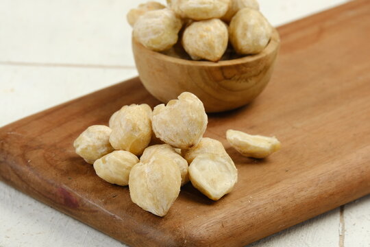 a pile of Candlenuts or kemiri or Aleurites moluccanus	