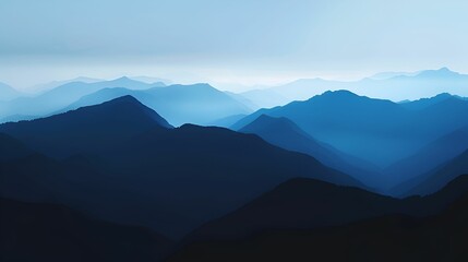 Fototapeta premium A serene landscape featuring layers of blue mountains fading into the horizon, creating a calming and peaceful atmosphere.
