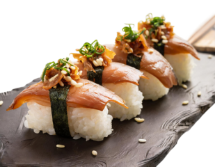 Bite sized pieces of brown rice sushi topped with smoked salmon