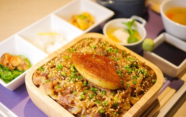seared foie gras beef rice bowl gyudon bento japanese don lunchbox lunch set close up view