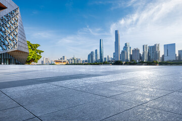 Empty square floor with modern city buildings scenery in Guangzhou. Road and buildings background.