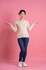 Image of beautiful Asian woman posing on a white background