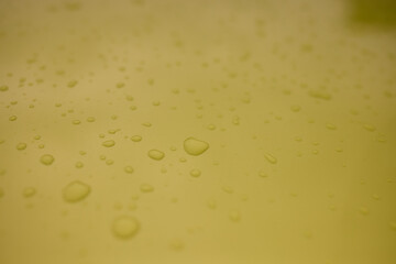 A serene image of water droplets on a smooth surface, capturing a tranquil and peaceful scene