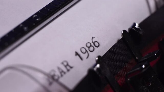 Year 1986, Typing on Blank White Paper in Vintage Typewriter, Close Up