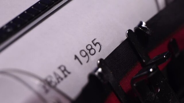 Year 1985, Typing on Blank White Paper in Vintage Typewriter, Close Up