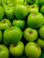 Photo of natural organic ripe sweet green apples. Sweet, fresh and healthy fruit.