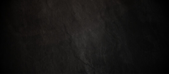 Abstract black stone wall texture grunge rock surface. dark gray background backdrop. wide panoramic banner. old wall stone for dark black distressed grunge background wallpaper rough concrete wall.