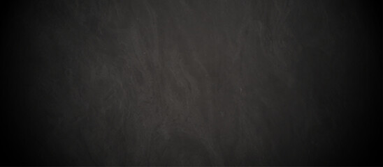 Abstract black stone wall texture grunge rock surface. dark gray background backdrop. wide panoramic banner. old wall stone for dark black distressed grunge background wallpaper rough concrete wall.