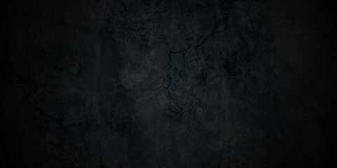 Abstract black stone wall texture grunge rock surface. dark gray background backdrop. wide panoramic banner. old wall stone for dark black distressed grunge background wallpaper rough concrete wall.