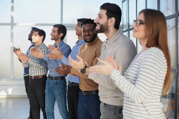 participants of the international business seminar give a standing ovation