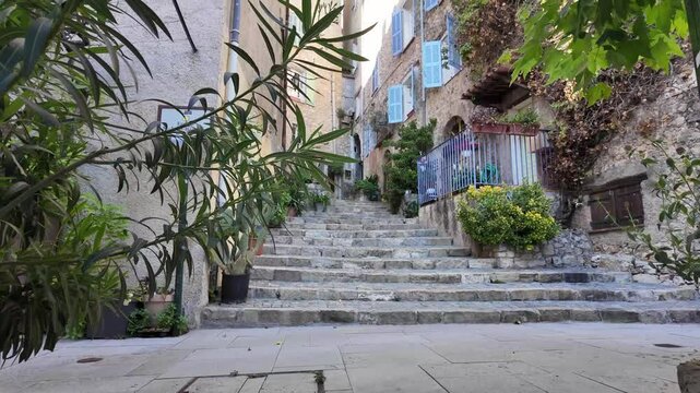 Fayence old stone provencal town in France with charming uphill streets filled with flower pots