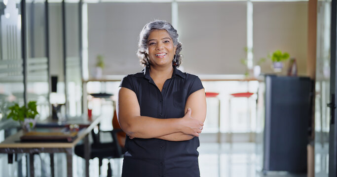 Indian Asian older aged adult boss ceo woman lady agent cross arms look cam do pose head shot video elder old gen x female worker staff expert standing proud fold hand indoor job office work place day