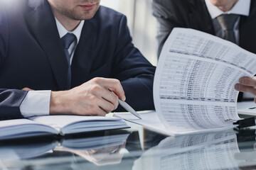 Sitting and working, consulting and suggesting work, checking work reports business office.