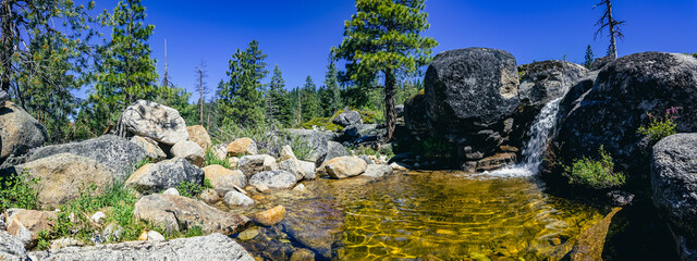 Panorama of a small waterfall in Sierra nevada mountains 