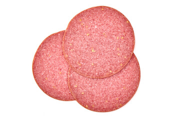 Thin salami sausage slices, isolated on white background.
