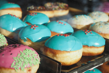 chocolate donuts display for sale at local store 