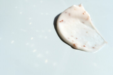 A smear of scrub on a light background. Beauty concept.