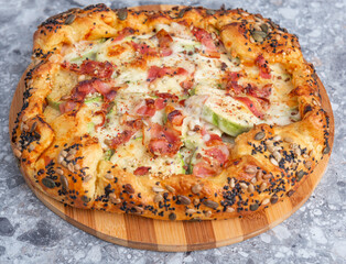 Pie with bacon, pumpkin and cheese