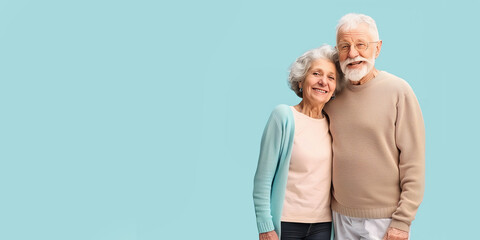 happy senior couple on solid background