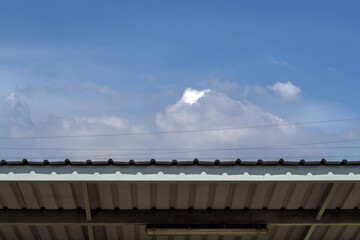 The copy space of the cloud in the sky on the metal roof