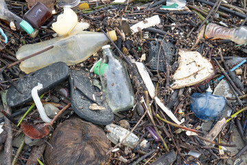 A sandy beach filled with human-made garbage