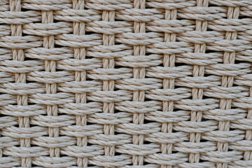 Texture closeup of braided gray ropes.
