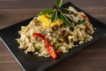 A view of a plate of spicy curry fried rice.