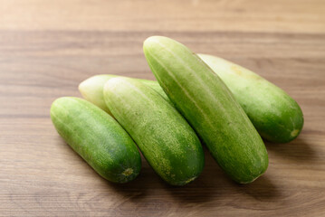 Fresh cucumber on wooden background, Organic vegetable, Food ingredient