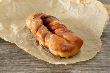 A view of a cinnamon twist donut.