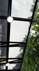 Transparent glass awning over front door of restaurant building