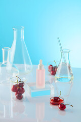 The countertop of white color in lab displaying plenty experiment utensils and fresh cherry, which as common ingredient for many cosmetics or beauty care products, unlabeled bottle for advertising