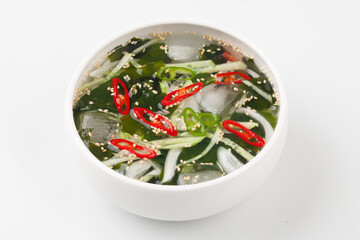 A food made by cutting cucumbers into small pieces, pickling them in salt or soy sauce, adding them to cold soup, and adding green onions, vinegar, sugar, and red pepper powder.
