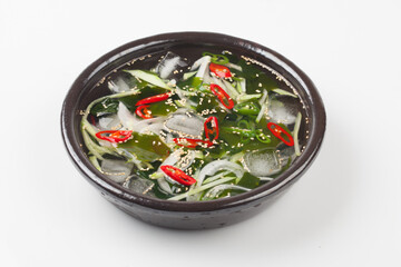 A food made by cutting cucumbers into small pieces, pickling them in salt or soy sauce, adding them to cold soup, and adding green onions, vinegar, sugar, and red pepper powder.
