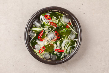 A food made by cutting cucumbers into small pieces, pickling them in salt or soy sauce, adding them...