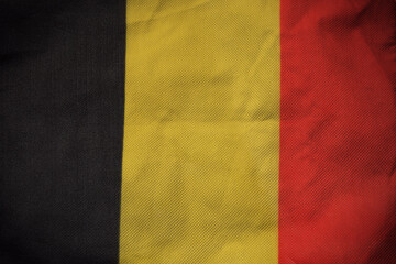 Belgium nation flag on crumpled fabric background , country flag