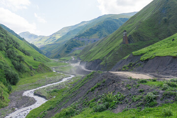 Canyon with a river and road surrounded by mountains and rocks. Lebaiskari tower on a mountain