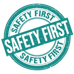 SAFETY FIRST text written on blue round stamp sign