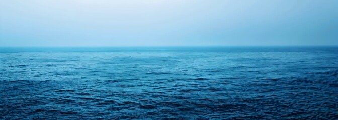 Obraz premium A wide shot of an ocean blue background, with the bottom edge slightly blurred 