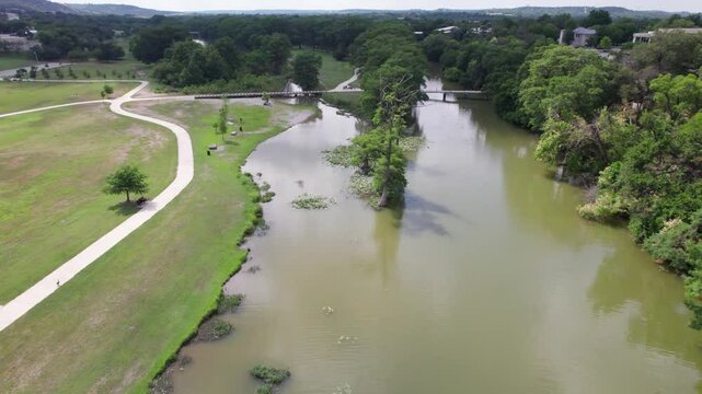 This is an aerial video flying over the Guadalupe River in Kerrville Texas.  Camera flies near the Louise Hays Park.