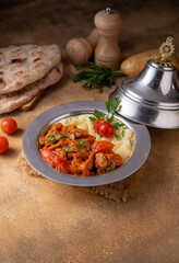 Sliced grill chicken and mushroom sauce served with mashed potato .