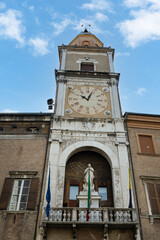 Clock Tower and Statue of the Virgin in the Municipal Palace of Modena, Italy