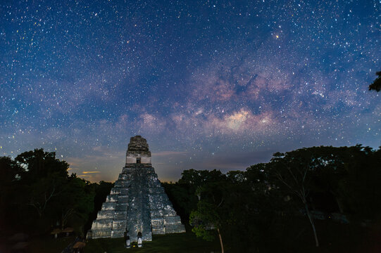 temple under the milky way in tikal guatemala