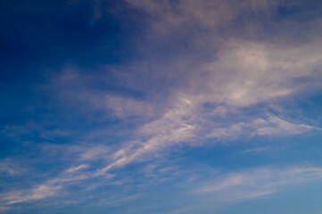 Fluffy orange clouds at sunset