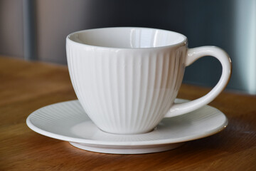 Ceramic white mug with saucer