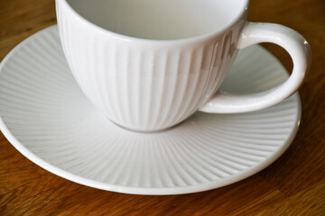 Ceramic white mug with saucer
