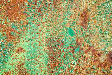 Texture of peeling bright paint on rusty metal. Abstract background.