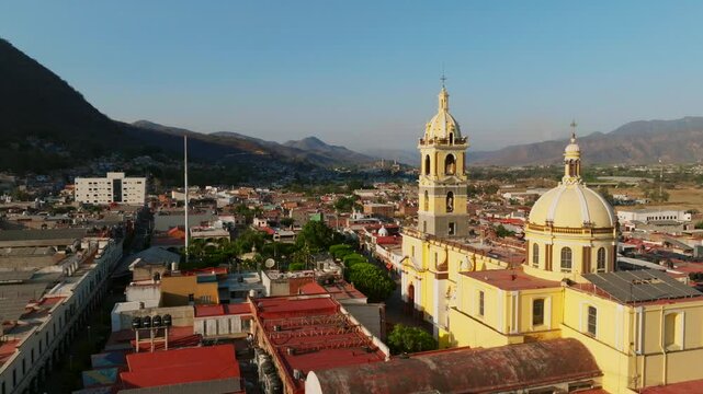 Dolly in drone flight near Our Lady of the Sanctuary Church in Tamazula de Gordiano's city center