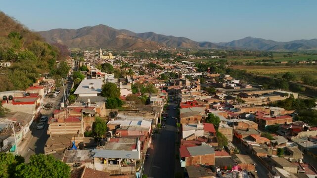 Dolly in drone flight over a residential area in the Mexican town of Tamazula de Gordiano, Mexico